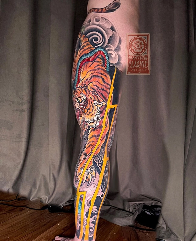 Tiger-Snake leg sleeve tattoo by Mathew Clarke